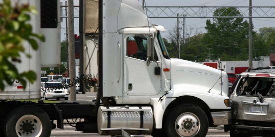 commercial size truck colliding with a van