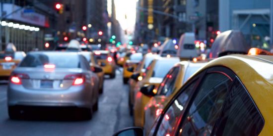 line up of taxis in traffic